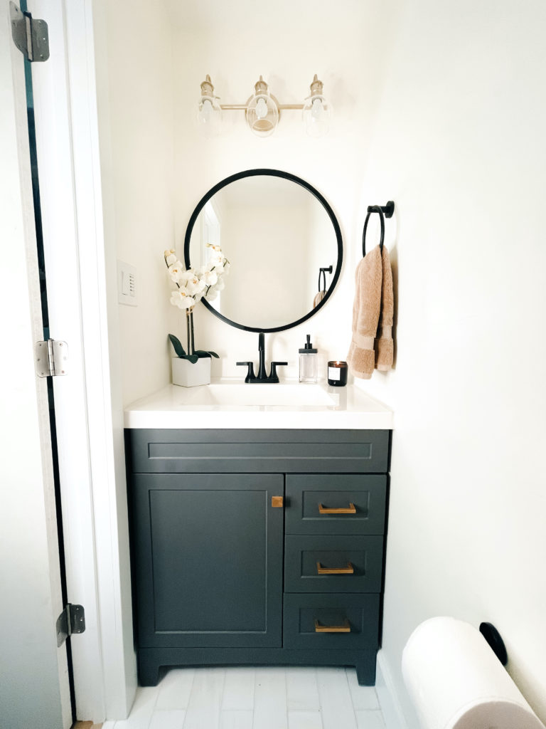 Gray, black and gold powder bathroom