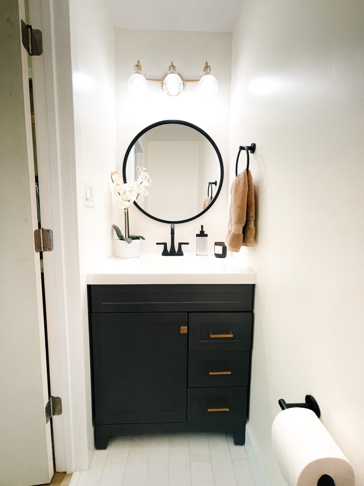 Gray, black and gold powder bathroom