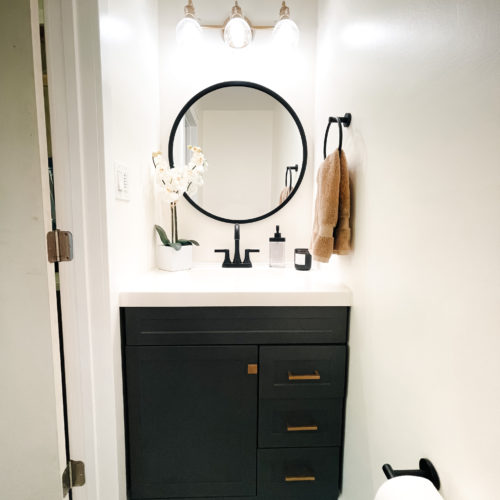 Gray, black and gold powder bathroom