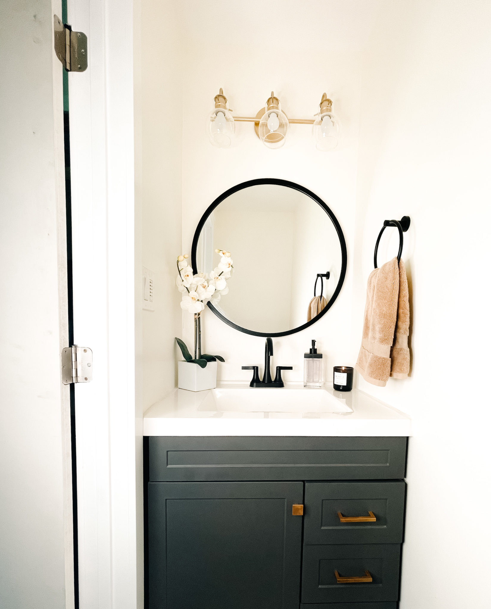 Gray, black and gold powder bathroom