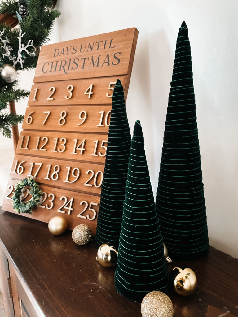 green velvet ribbon wrapped around cones to create a modern christmas tree