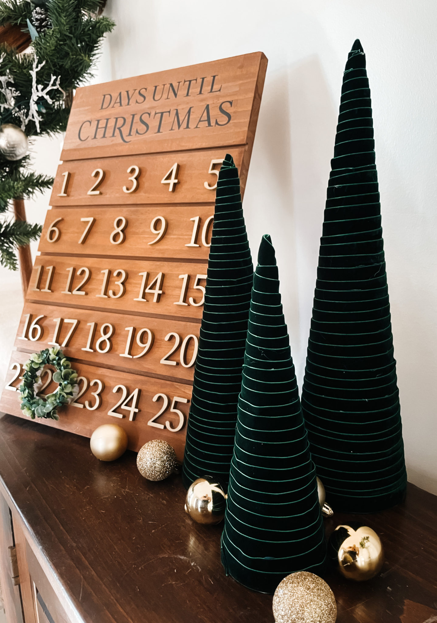 green velvet ribbon wrapped around cones to create a modern christmas tree