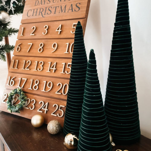 green velvet ribbon wrapped around cones to create a modern christmas tree