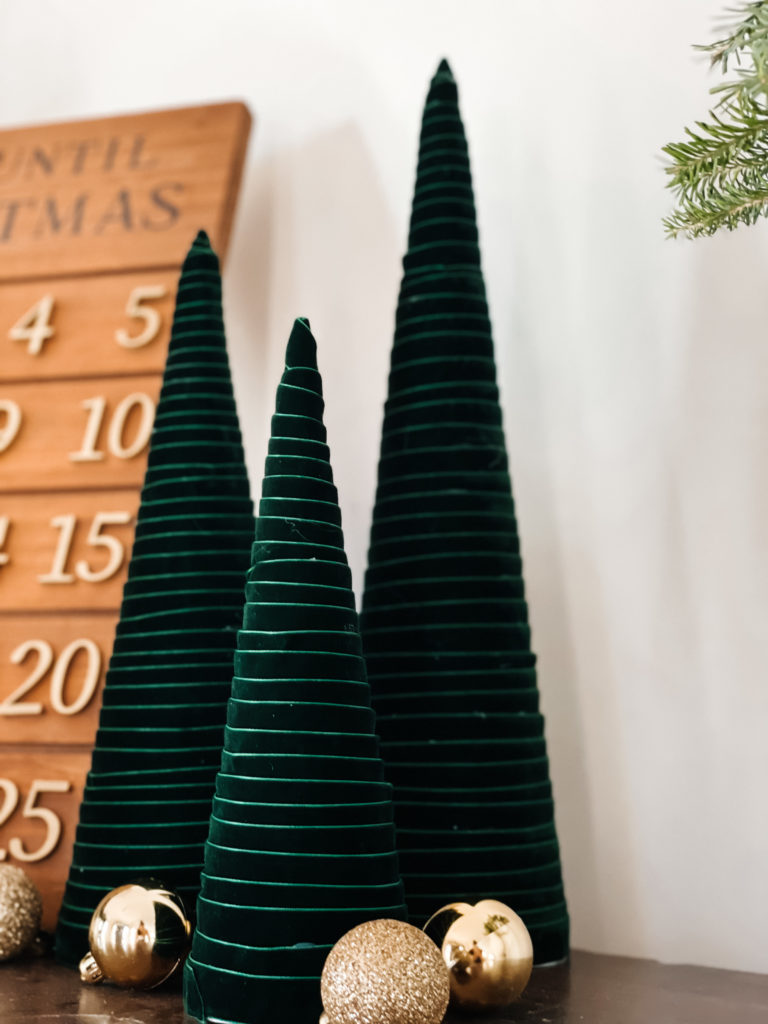 green velvet ribbon wrapped around cones to create a modern christmas tree